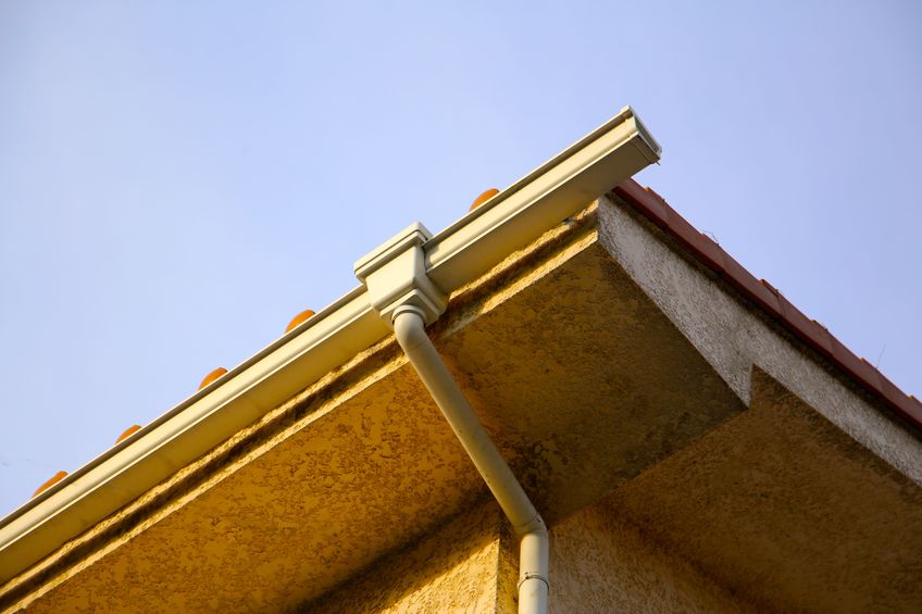 clogged gutters on residential home